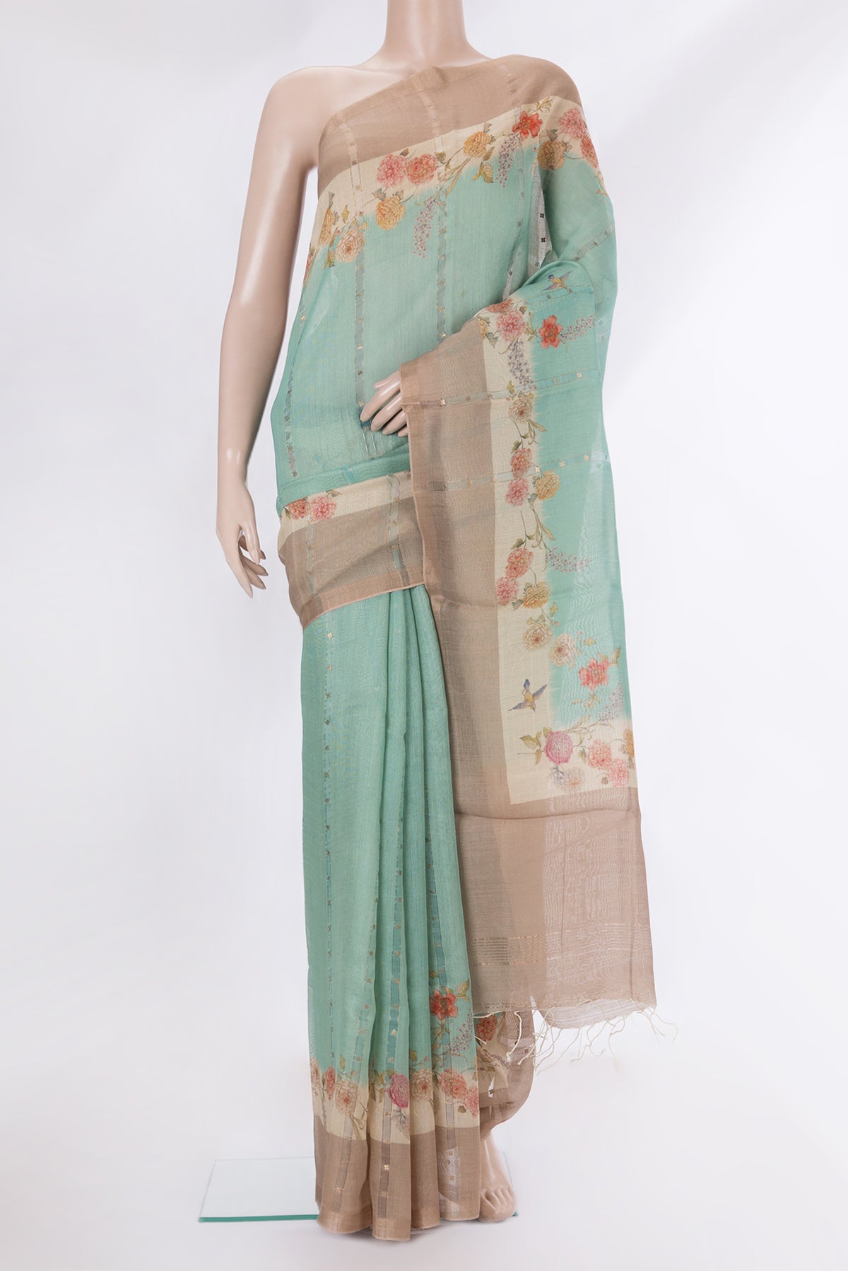 Pure Silk Light Green Dual Tone Tussar Saree with Embroidery on the body and Fancy Border.  displayed on a mannequin