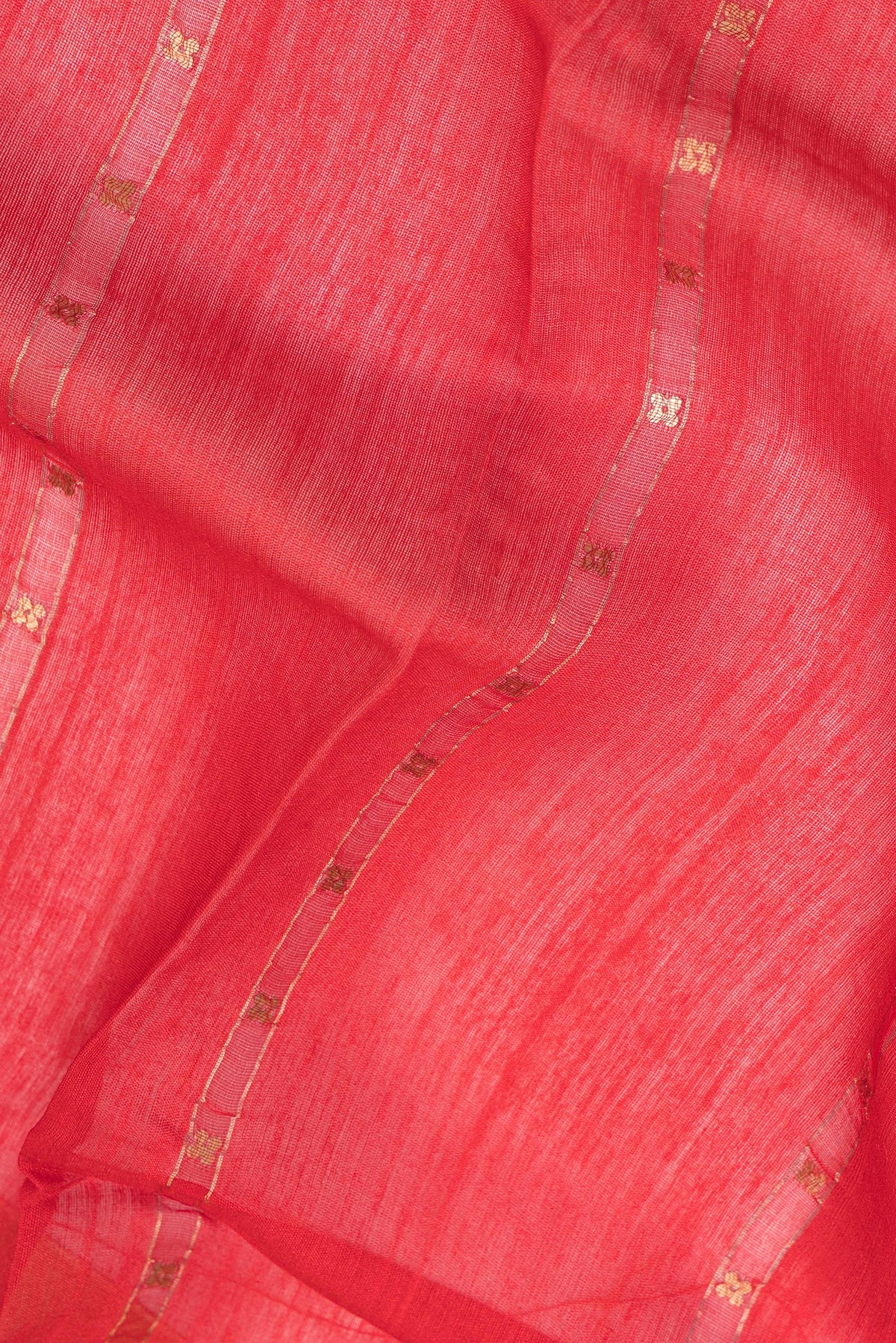 Close up of Pure Silk Red Dual Tone Tussar Saree with Embroidery on the body and Fancy Border.  displaying folds