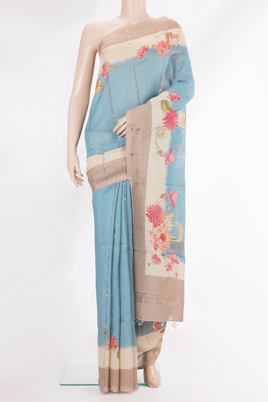Pure Silk Sky Blue Dual Tone Tussar Saree with Embroidery on the body and Fancy Border.  displayed on a mannequin