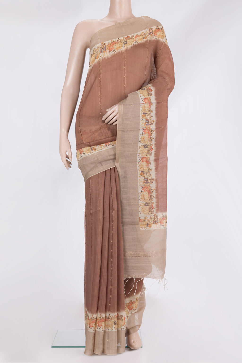 Brown Tussar Saree with Embroidery on the body and Fancy Border.  displayed on a mannequin