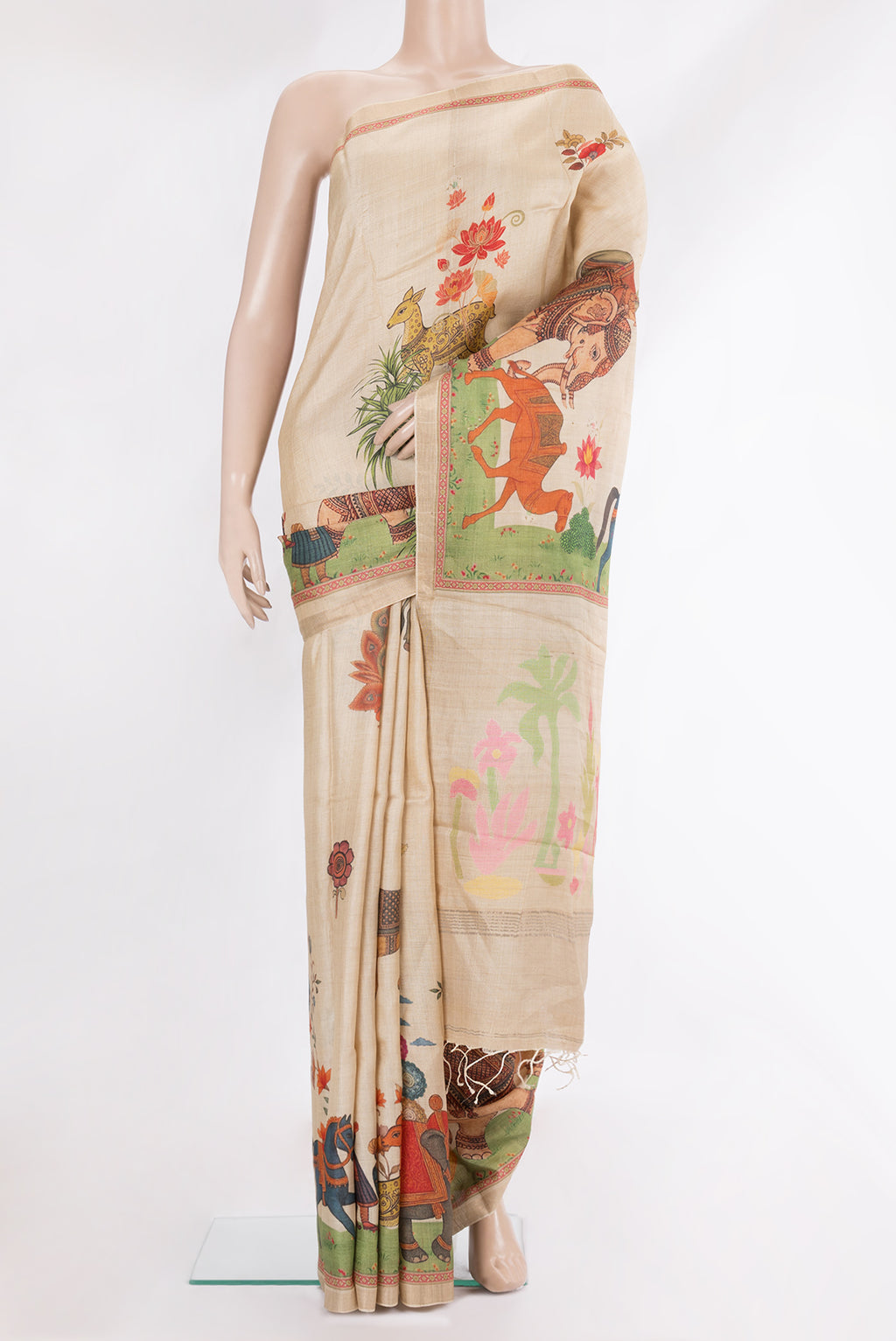 Pure Silk Beige Dual Tone Tussar Saree with Printed design on the body and Fancy Border.  displayed on a mannequin