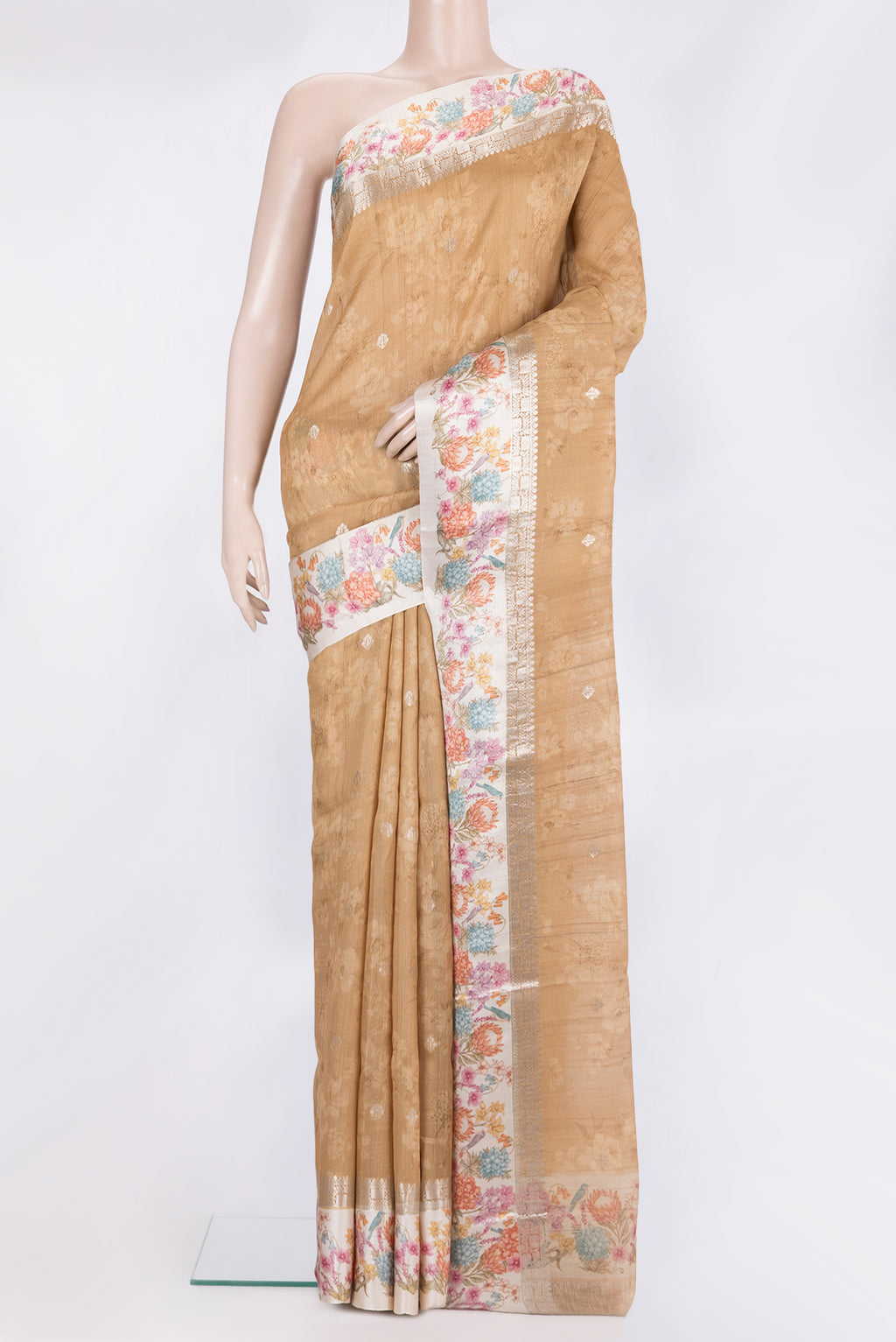 Pure Silk Sandal Tussar Saree with Floral Print on the body and Fancy Border.  displayed on a mannequin
