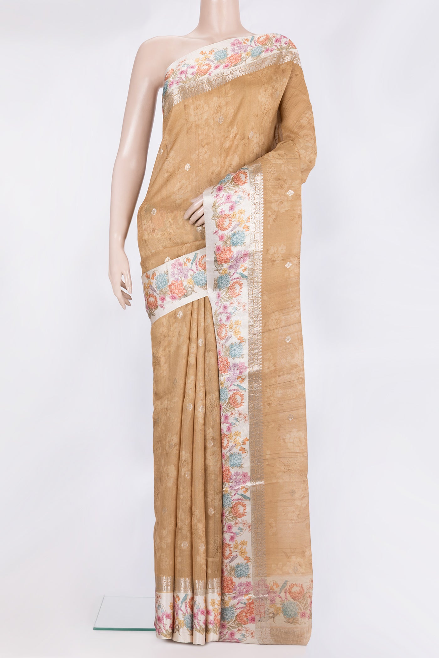 Pure Silk Sandal Tussar Saree with Floral Print on the body and Fancy Border.  displayed on a mannequin