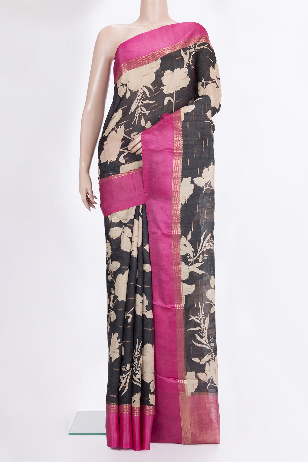 Black Tussar Saree with Printed design on the body and Fancy Border.  displayed on a mannequin