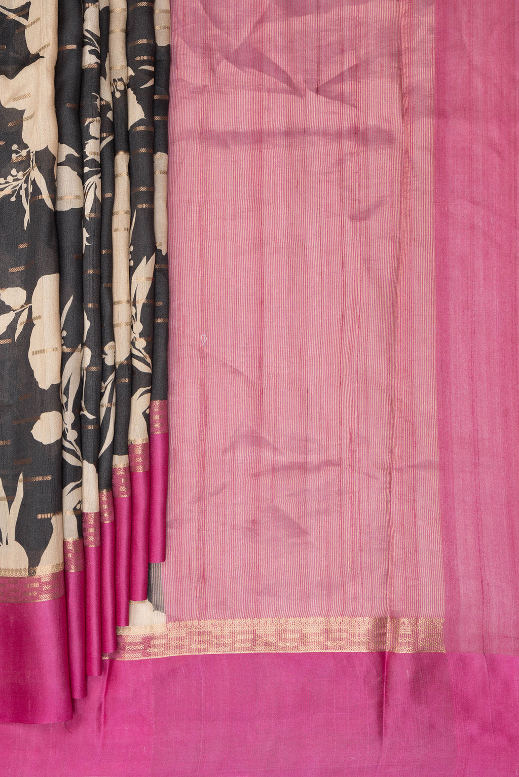 Pleats and pallu of Black Tussar Saree with Printed design on the body and Fancy Border. 