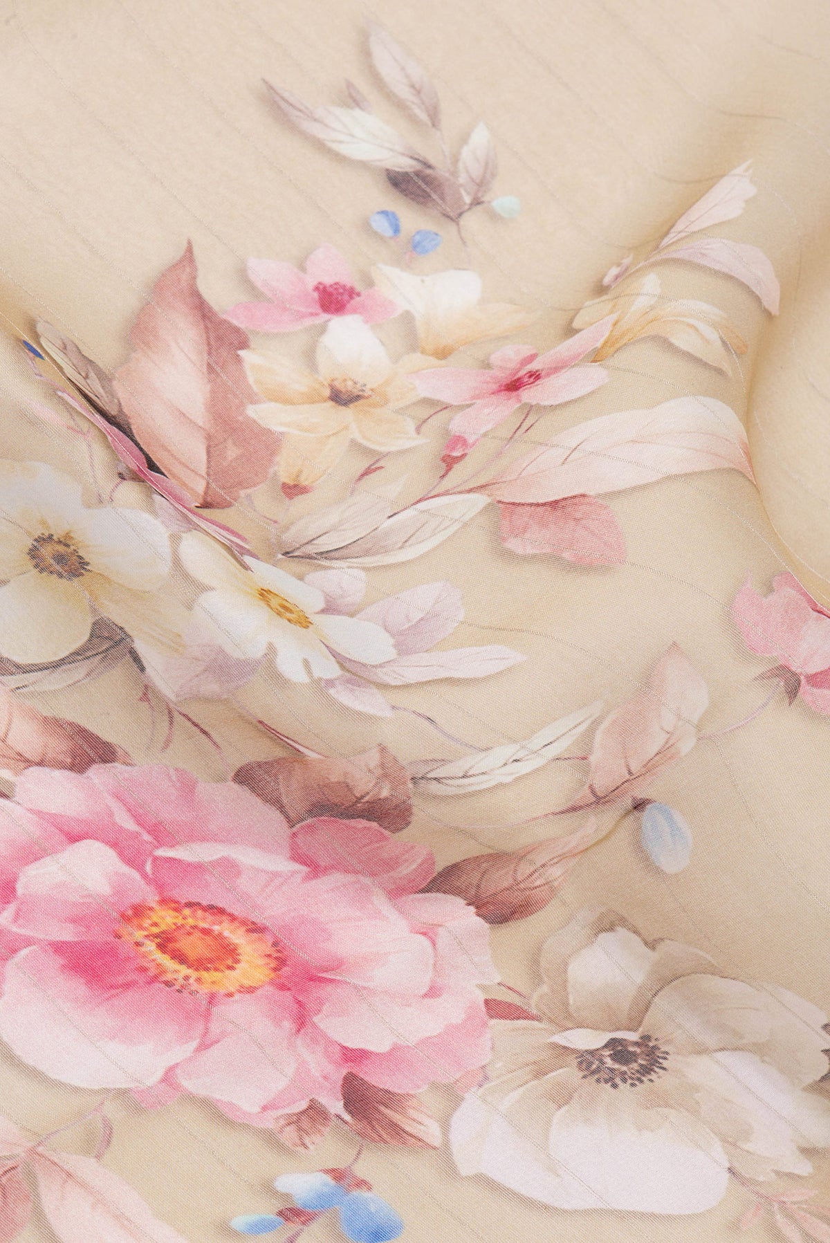 Close up of Beige Organza Silk Saree with Floral Print on the body and Satin Border.  displaying folds