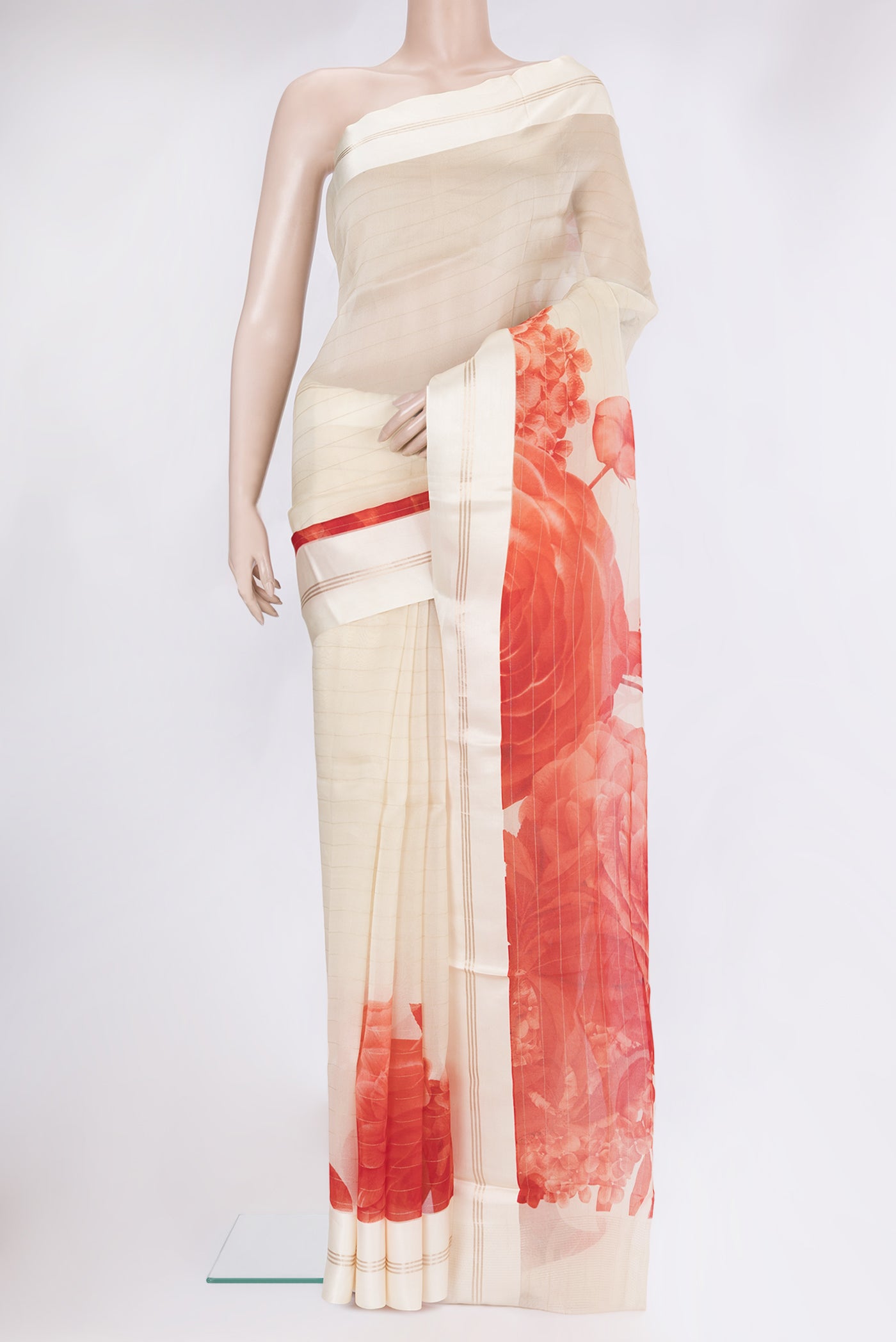Cream Organza Silk Saree with Floral Print on the body and Satin Border.  displayed on a mannequin