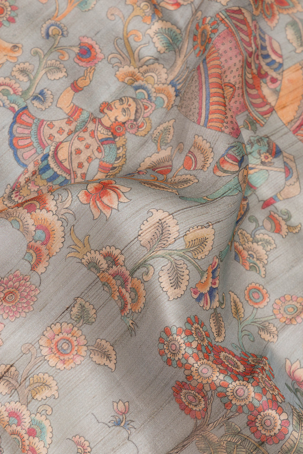 Close up of Pure Silk Grey Tussar Saree with Printed design on the body and Fancy Border.  displaying folds