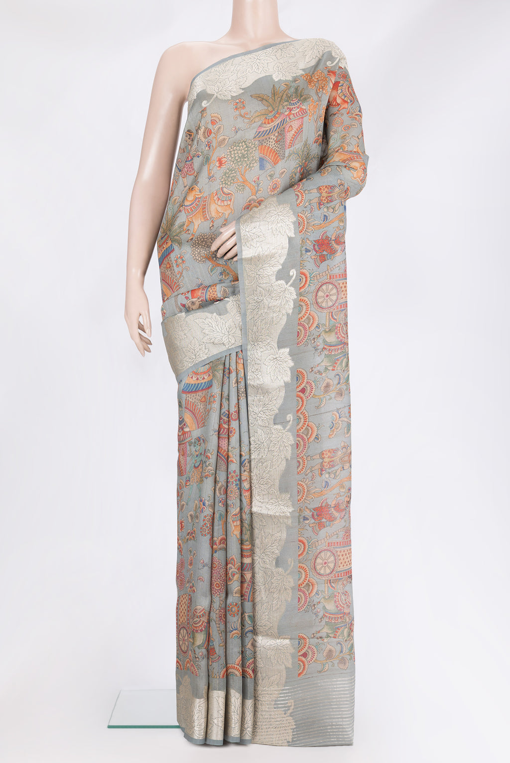 Pure Silk Grey Tussar Saree with Printed design on the body and Fancy Border.  displayed on a mannequin