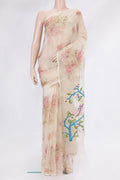 Beige Organza Silk Saree with Floral Print on the body and Without Border.  displayed on a mannequin