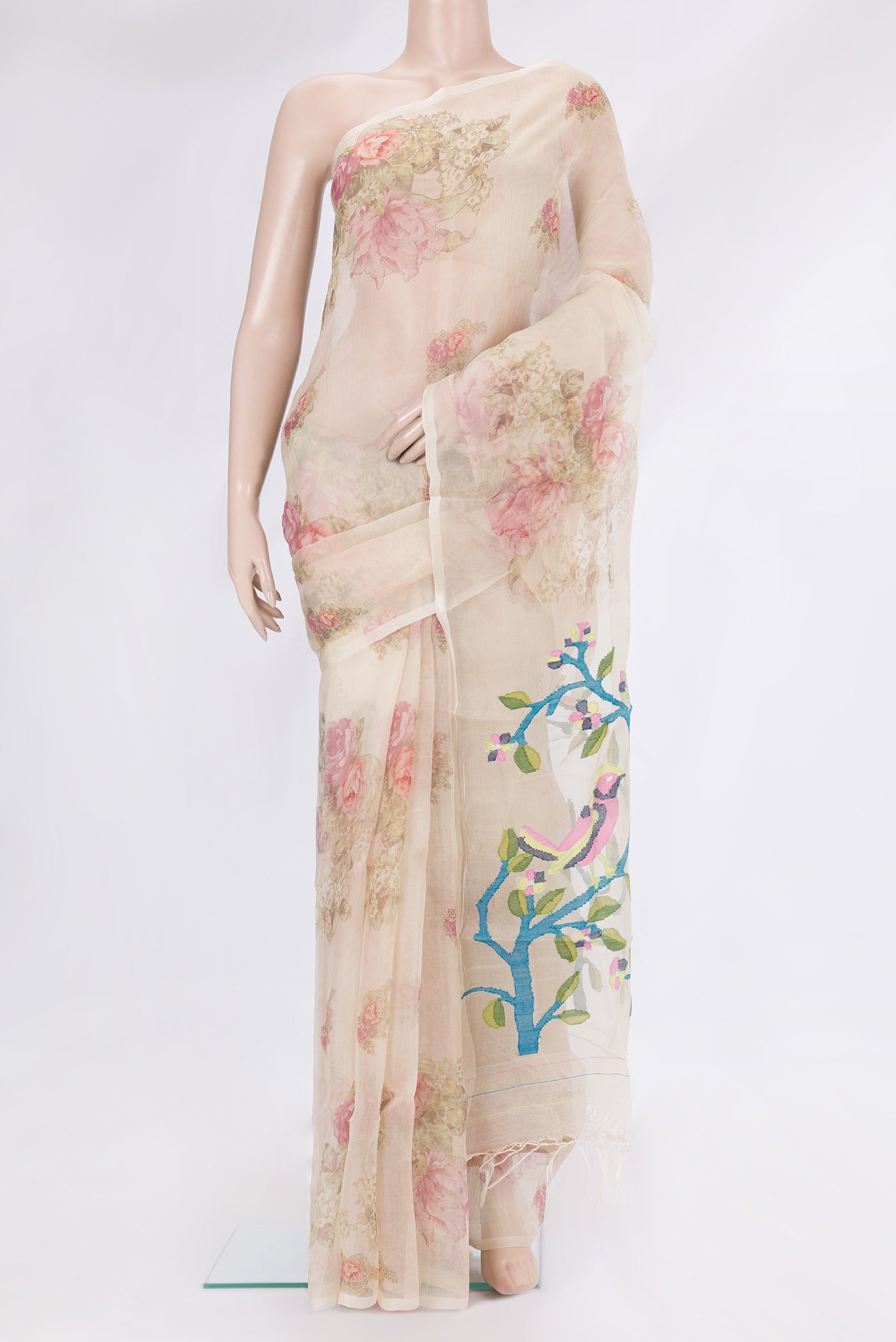 Beige Organza Silk Saree with Floral Print on the body and Without Border.  displayed on a mannequin