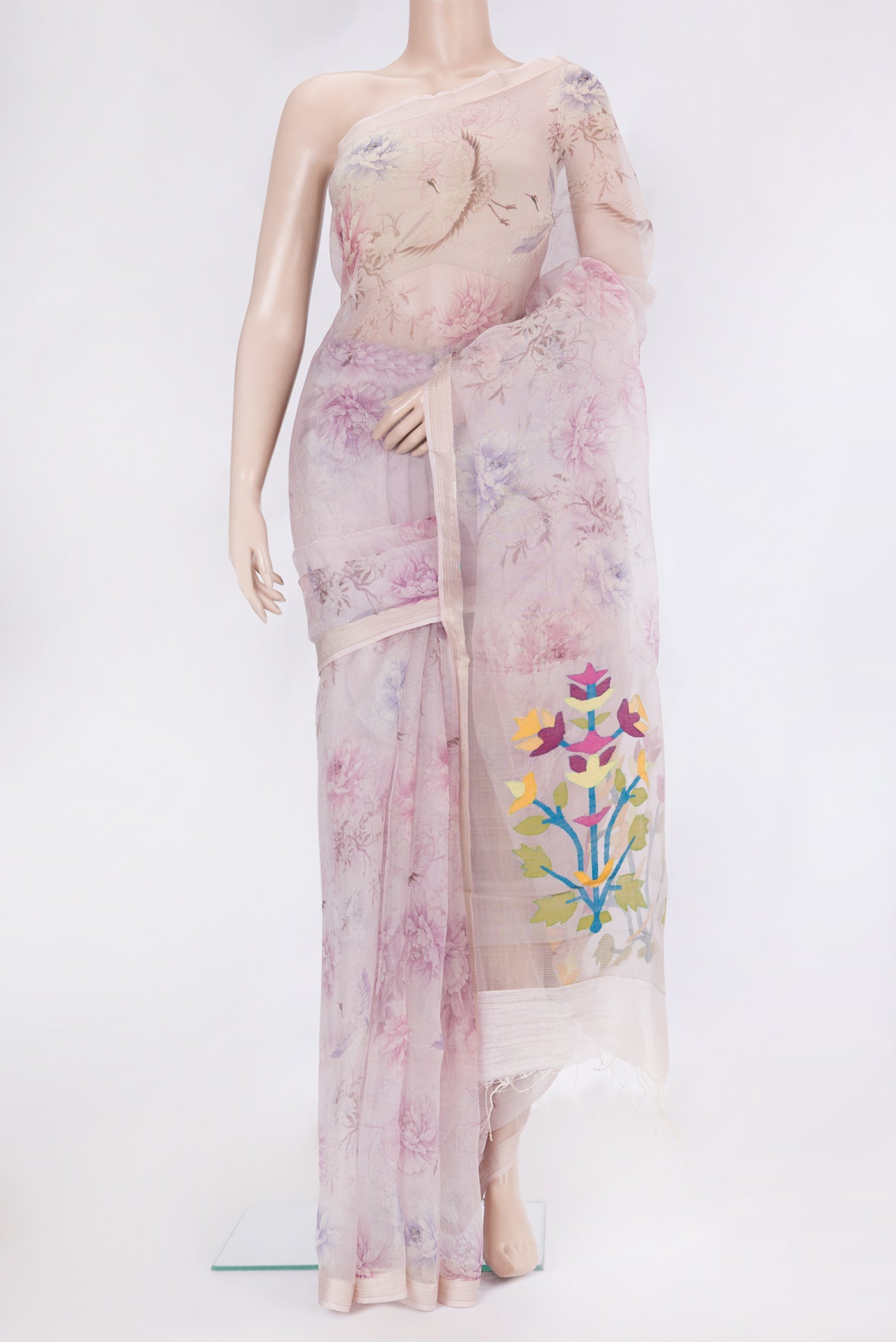 Lavender Organza Silk Saree with Printed design on the body and Zari Border.  displayed on a mannequin