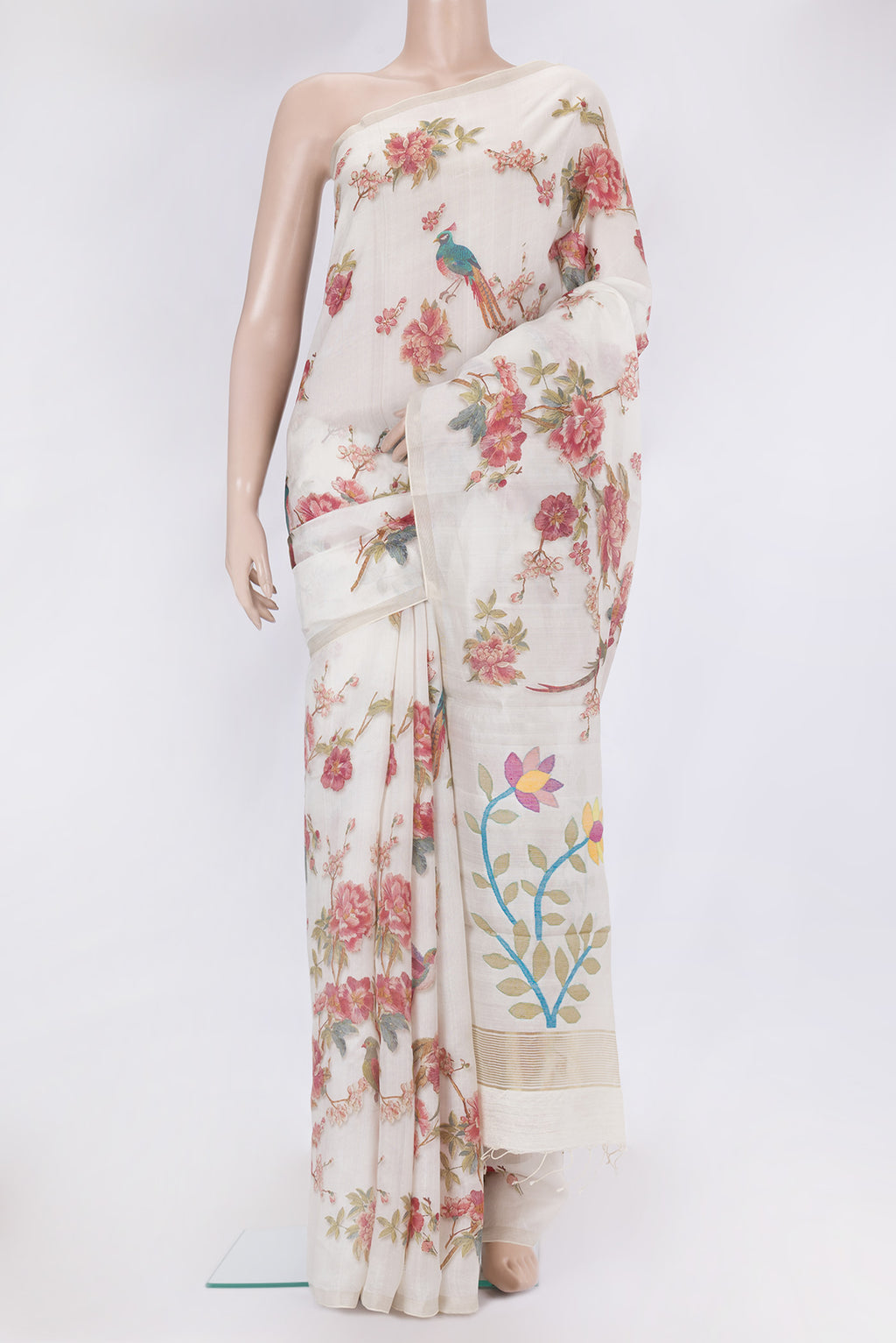 Off White Organza Silk Saree with Floral Print on the body and Zari Border.  displayed on a mannequin