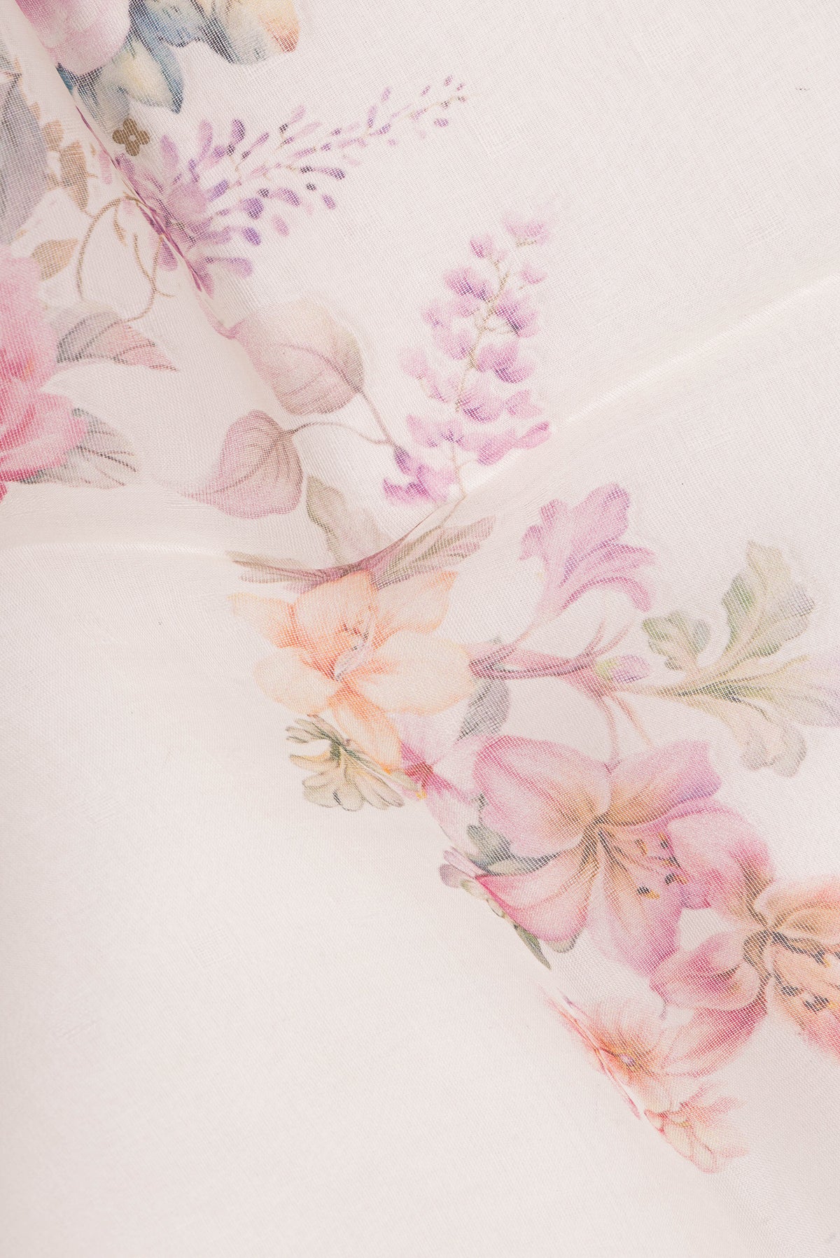 Close up of Pure Silk Off White Dual Tone Tussar Saree with Printed design on the body and Fancy Border.  displaying folds