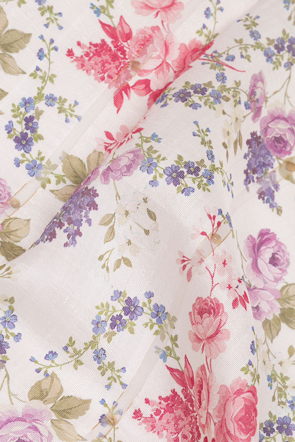 Close up of Off White Tussar Saree with Floral Print on the body and Zari Border.  displaying folds