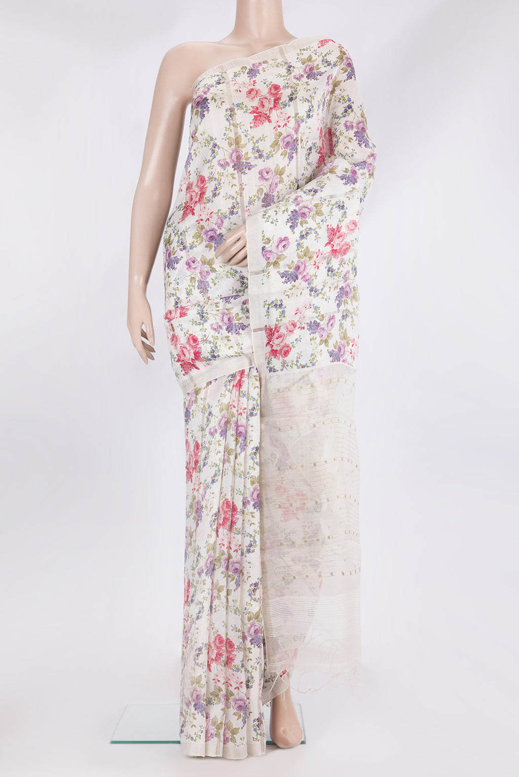 Off White Tussar Saree with Floral Print on the body and Zari Border.  displayed on a mannequin