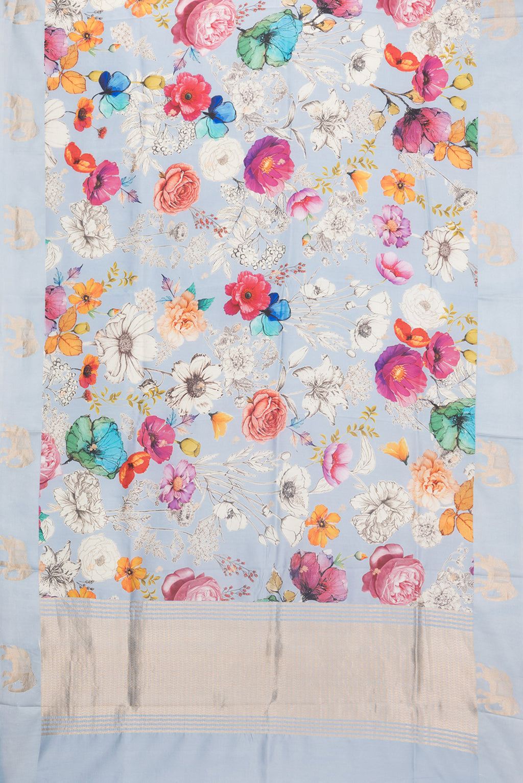 Flat view of Pure Silk Sky Blue Tussar Saree with Zari Butta on the body and Fancy Border. 