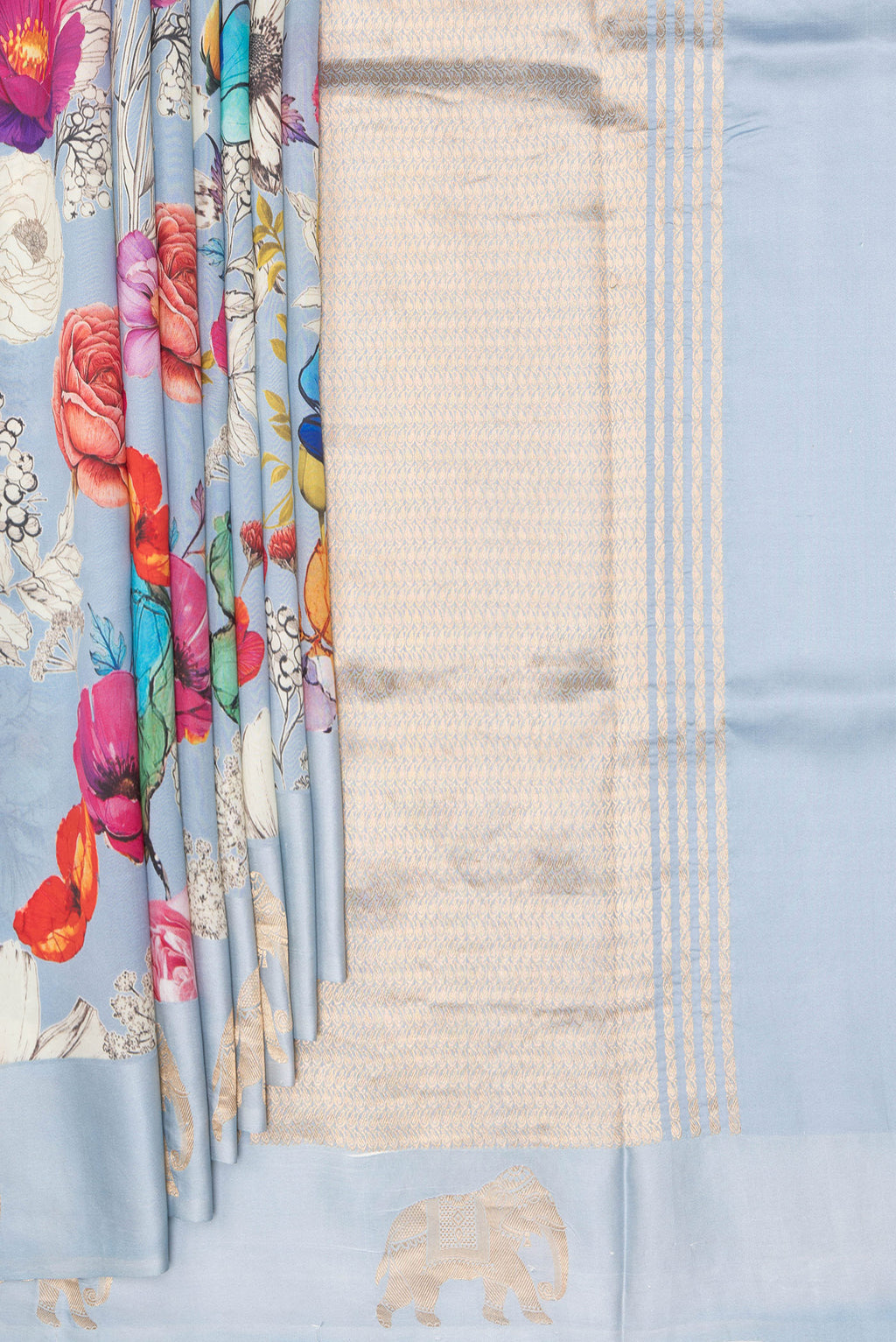 Pleats and pallu of Pure Silk Sky Blue Tussar Saree with Zari Butta on the body and Fancy Border. 