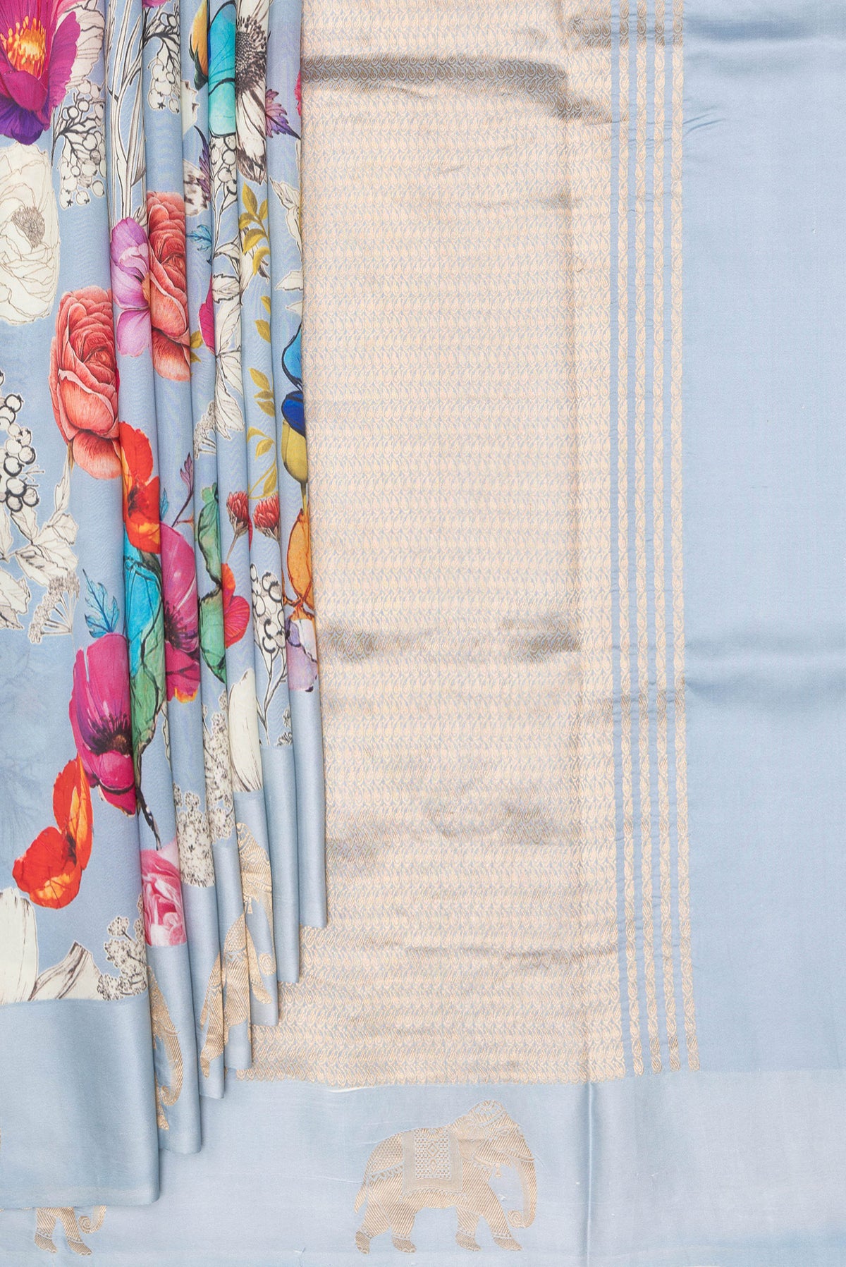 Pleats and pallu of Pure Silk Sky Blue Tussar Saree with Zari Butta on the body and Fancy Border. 