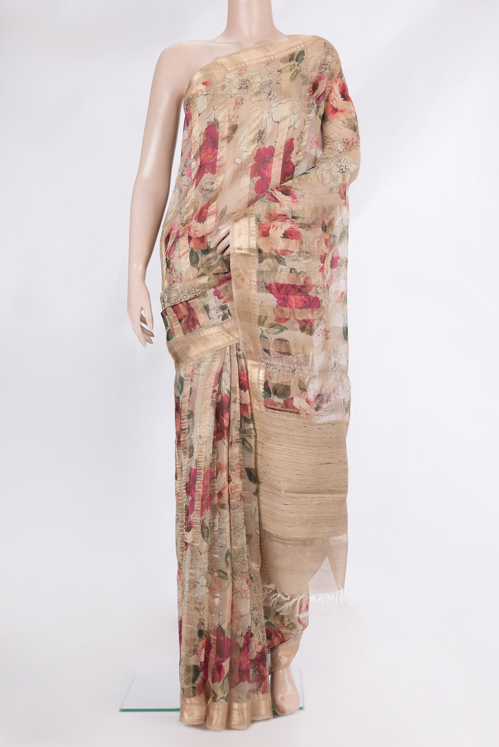 Beige Organza Saree with Printed design on the body and Zari Border.  displayed on a mannequin