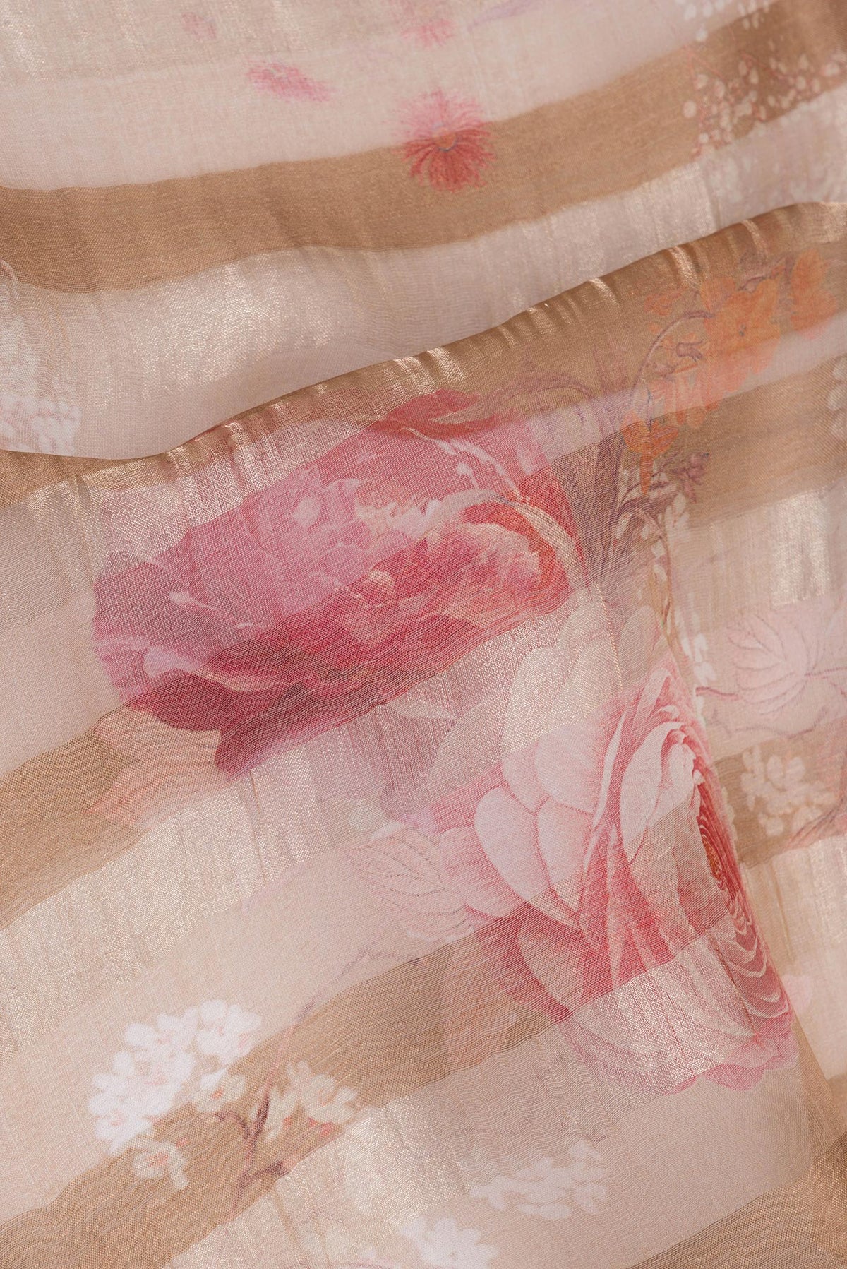 Close up of Pure Silk Rose Gold Dual Tone Tussar Saree with Stripes on the body and Zari Border.  displaying folds