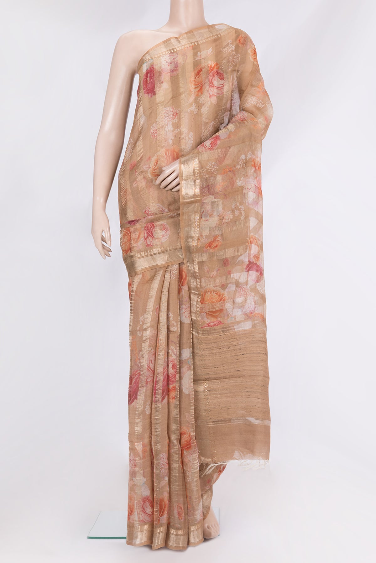Pure Silk Rose Gold Dual Tone Tussar Saree with Stripes on the body and Zari Border.  displayed on a mannequin