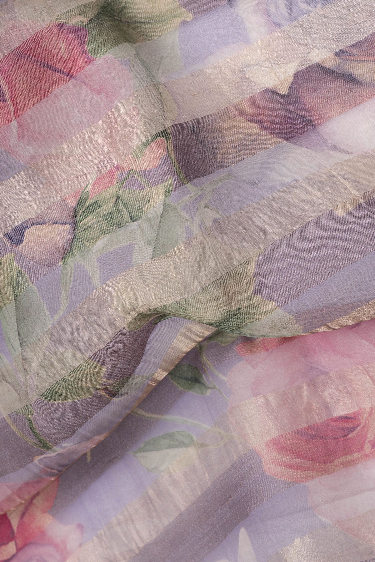 Close up of Lavender Organza Silk Saree with Stripes on the body and Zari Border.  displaying folds
