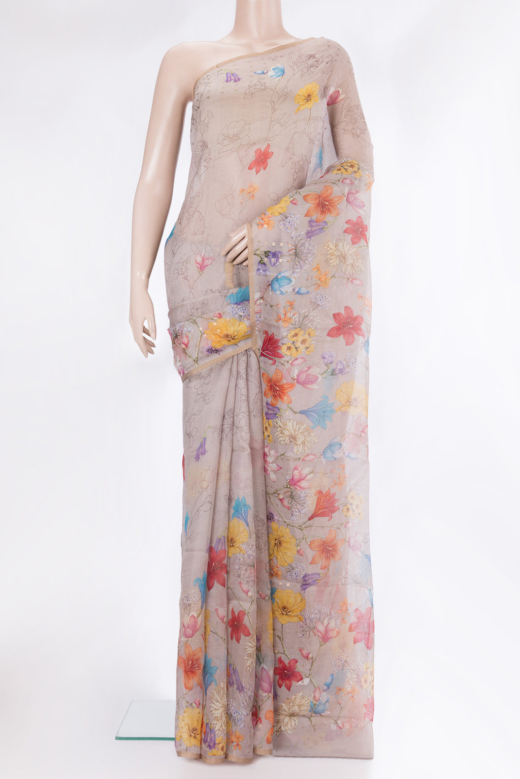 Beige Tussar Saree with Floral Print on the body and Sequin Border.  displayed on a mannequin