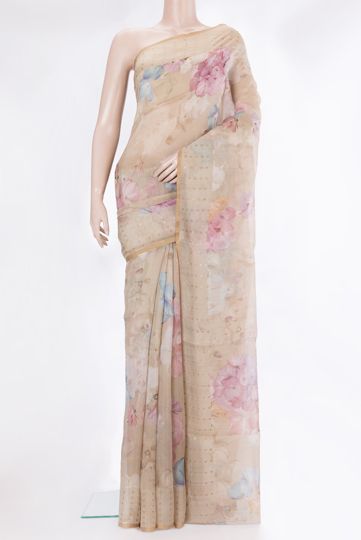 Beige Tussar Saree with Floral Print on the body and Sequin Border.  displayed on a mannequin
