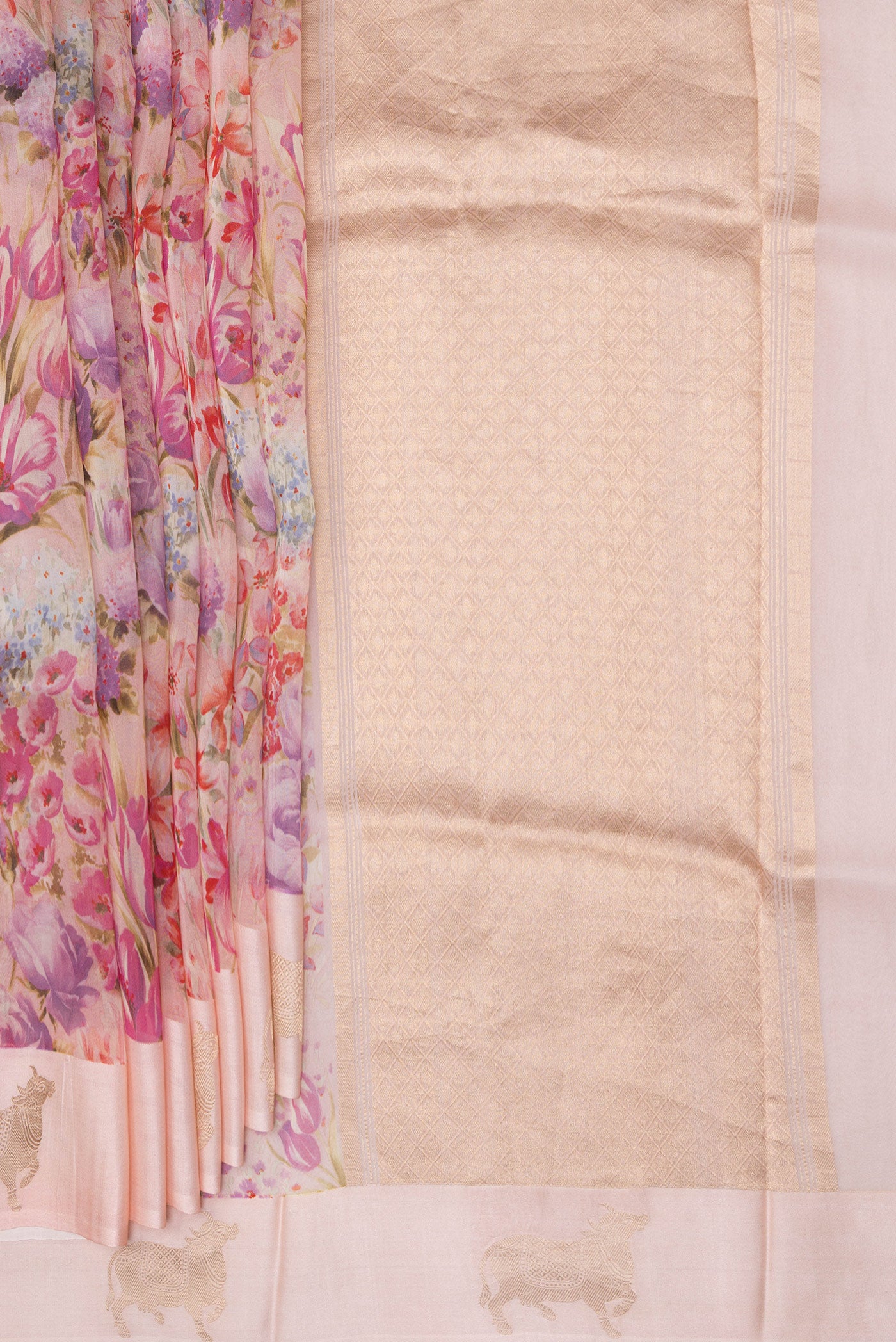 Pleats and pallu of Golden Peach Organza Silk Saree with Floral Print on the body and Fancy Border. 