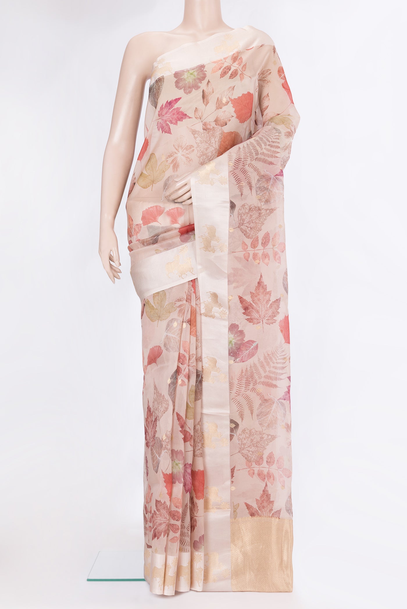Rose Gold Organza Silk Saree with Floral Print on the body and Fancy Border.  displayed on a mannequin