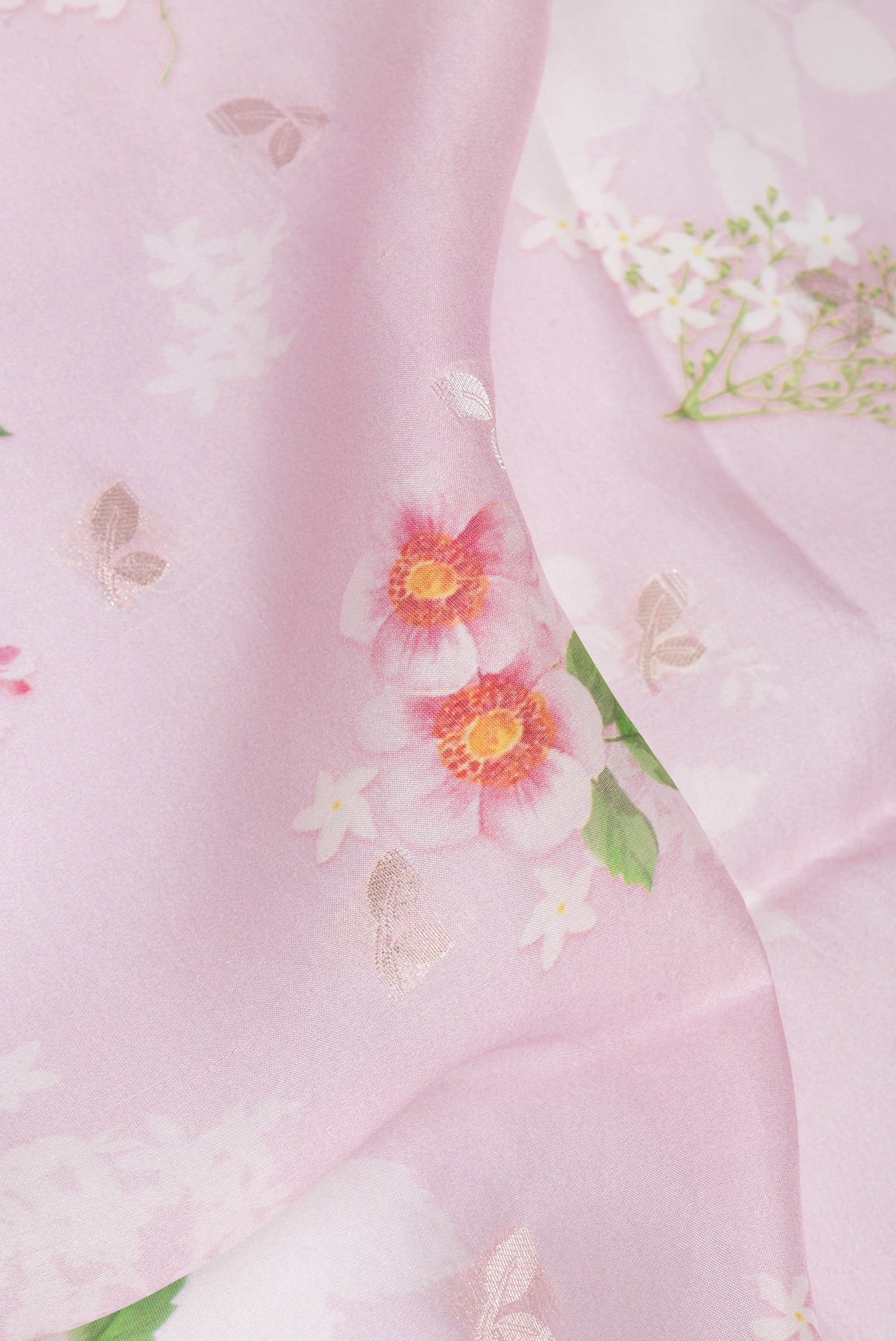 Close up of Pure Silk Lavender Tussar Saree with Floral Print on the body and Zari Border.  displaying folds