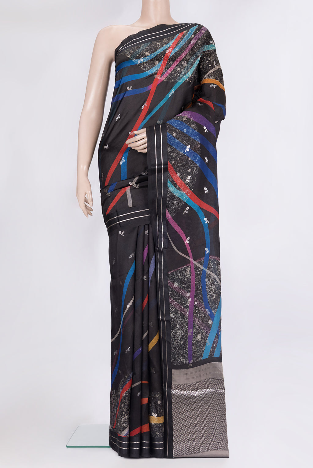 Pure Silk Black Tussar Saree with Zari Butta on the body and Fancy Border.  displayed on a mannequin