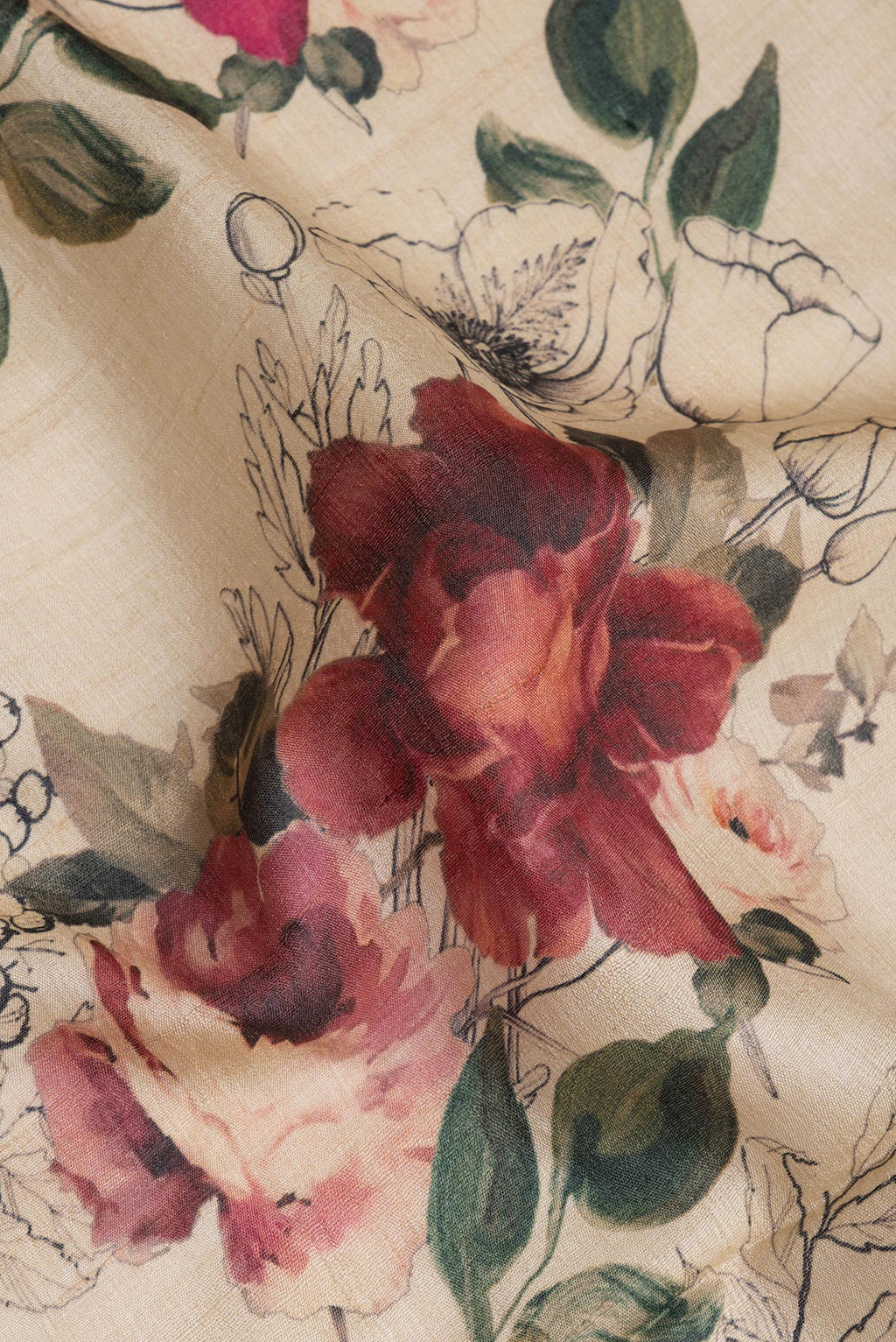 Close up of Beige Tussar Silk Saree with Floral Print on the body and Plain Border.  displaying folds
