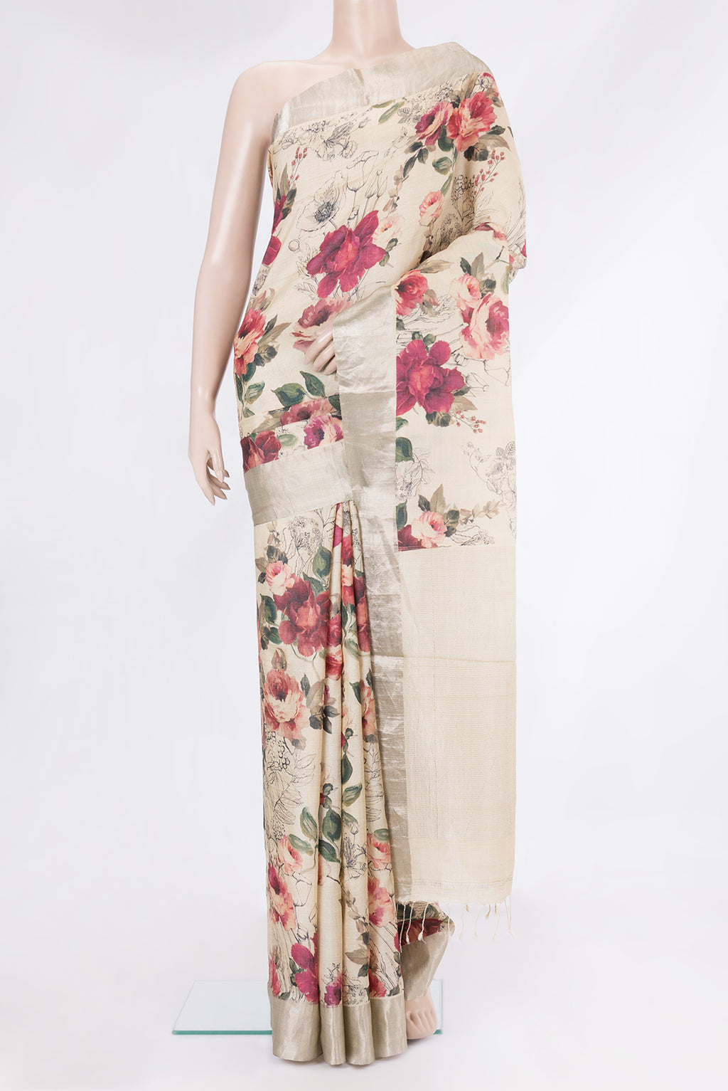 Beige Tussar Silk Saree with Floral Print on the body and Plain Border.  displayed on a mannequin