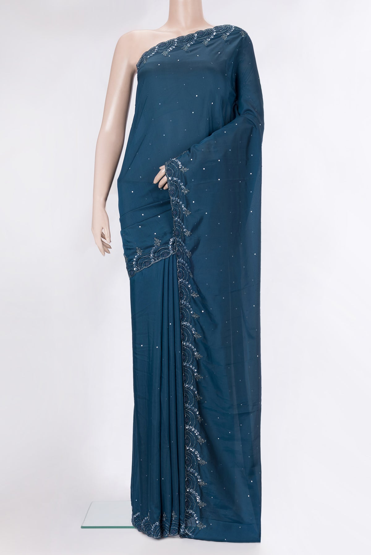 Peacock Blue Blended Satin Crepe Saree with Embroidery on the body and Embroidery Border.  displayed on a mannequin