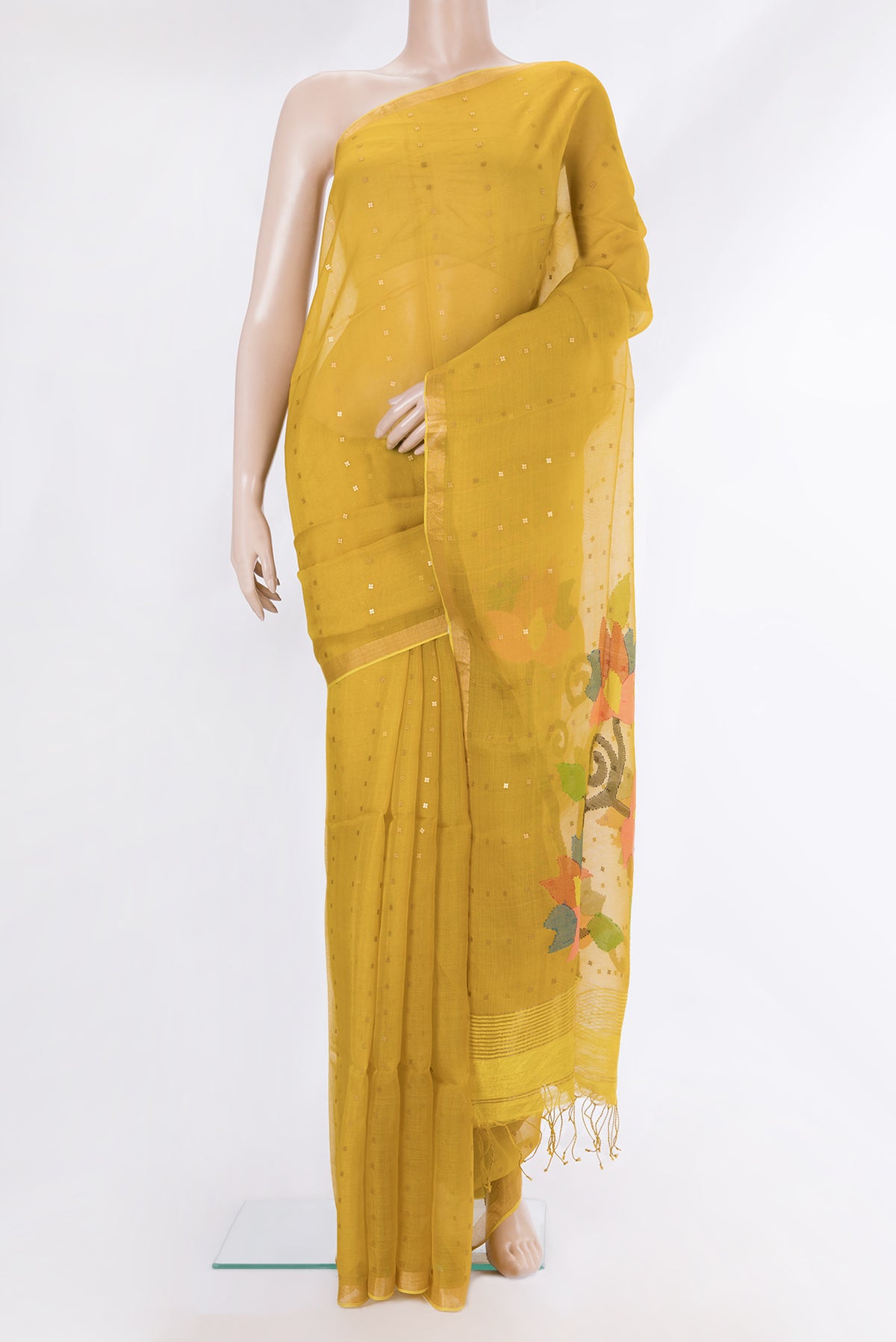Yellow Tussar Saree with Embroidery on the body and Zari Border.  displayed on a mannequin