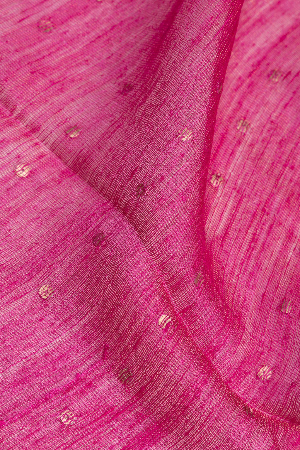 Close up of Pure Silk Dark Pink Tussar Saree with Embroidery on the body and Zari Border.  displaying folds