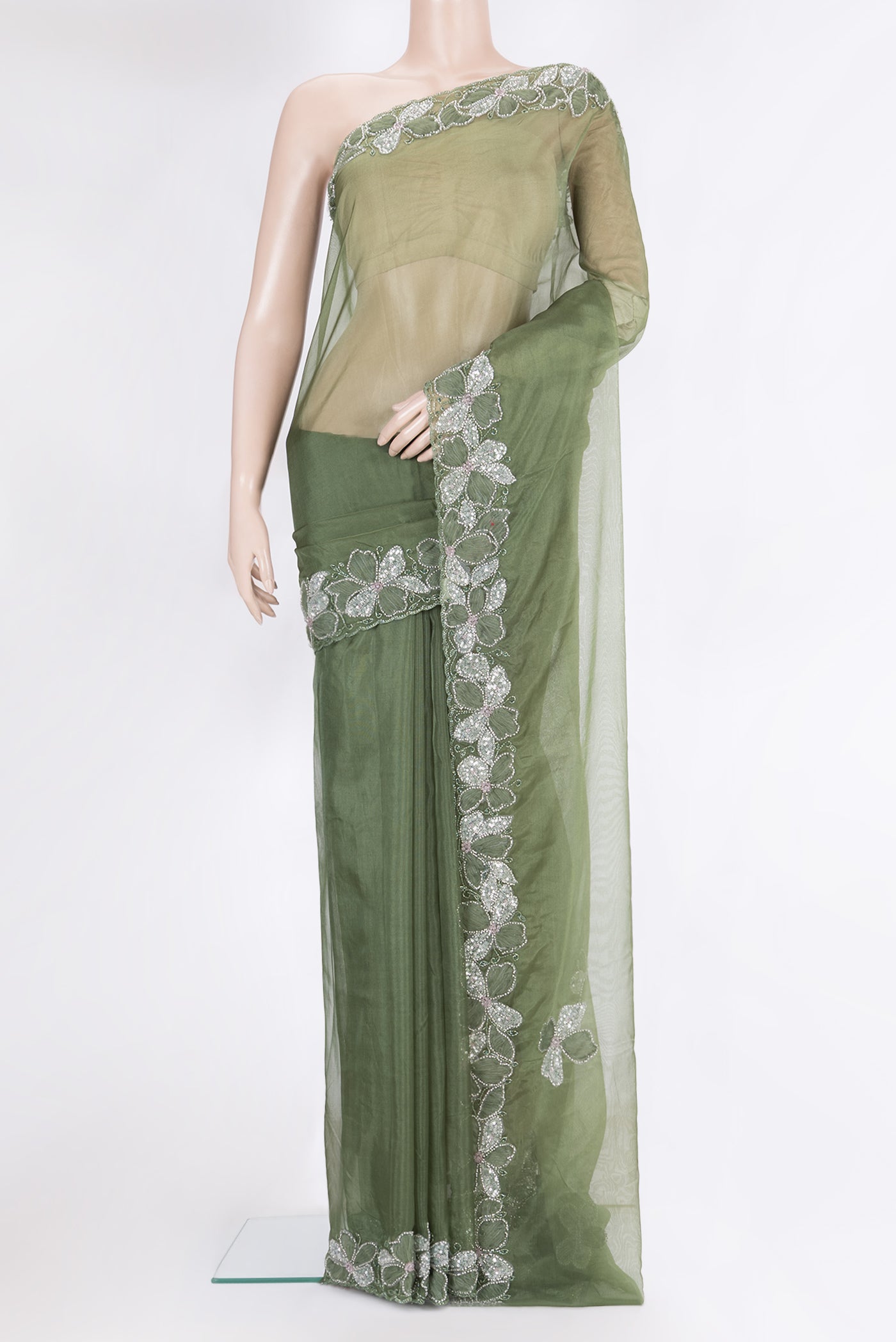 Olive Green Organza Silk Saree with Embroidery on the body and Embroidery Border.  displayed on a mannequin