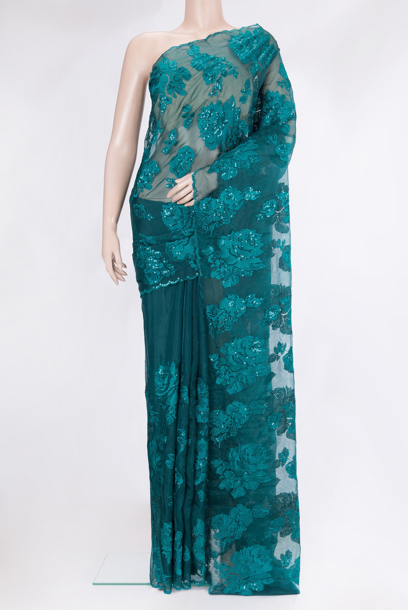 Green Blended Organza Silk Saree with Embroidery on the body and Embroidery Border.  displayed on a mannequin