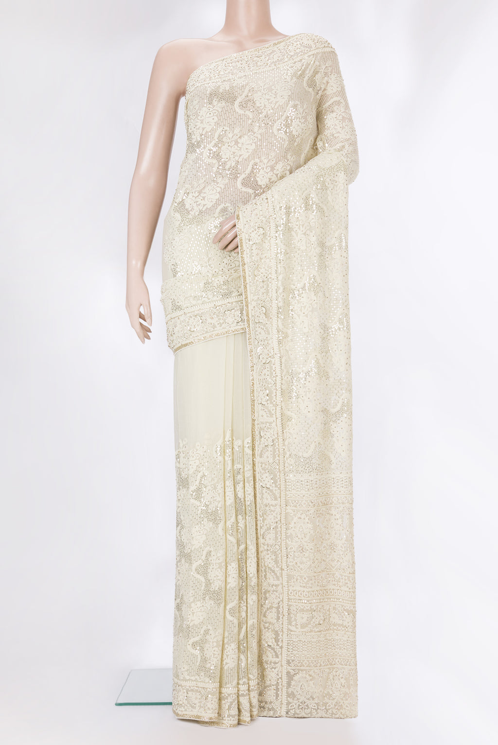 Off White Dual Tone Georgette Saree with Embroidery on the body and Sequin Border.  displayed on a mannequin