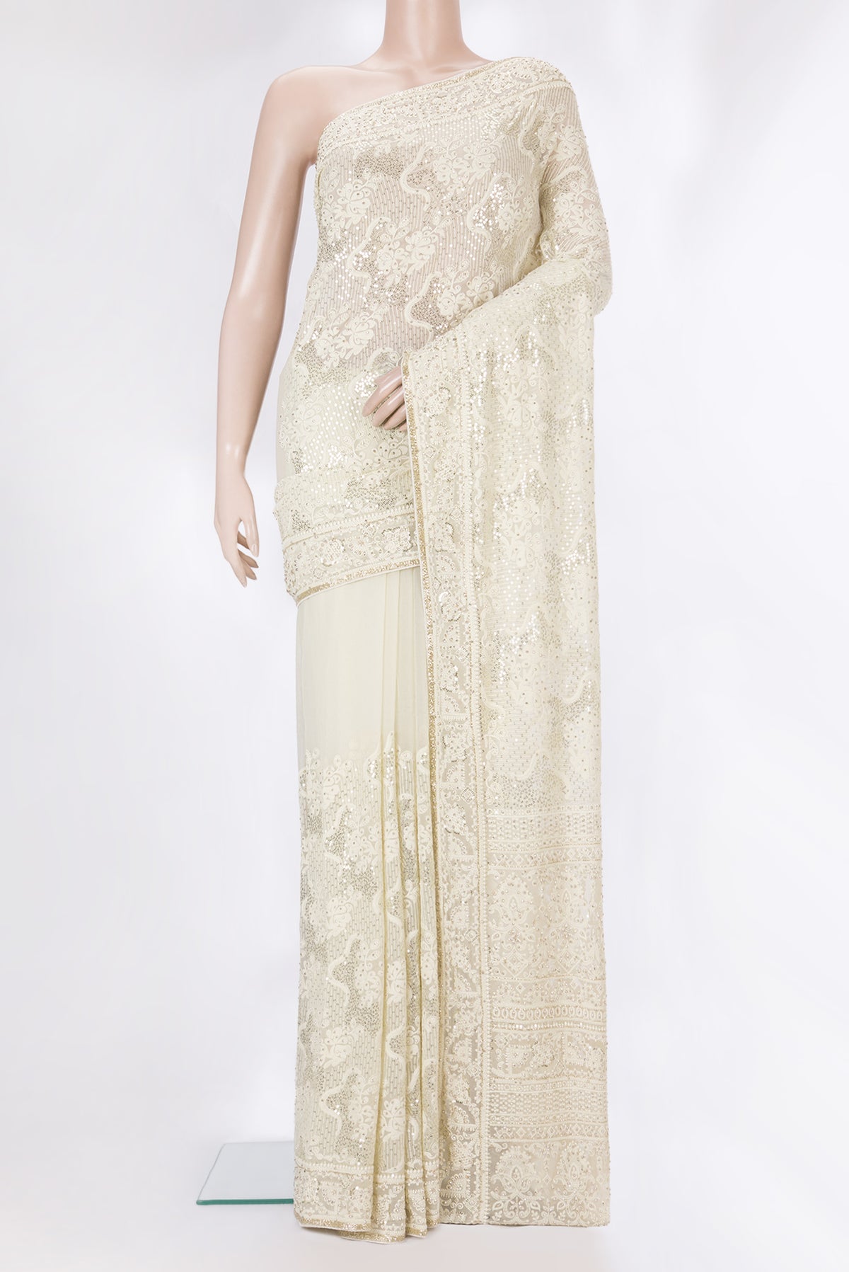 Off White Dual Tone Georgette Saree with Embroidery on the body and Sequin Border.  displayed on a mannequin