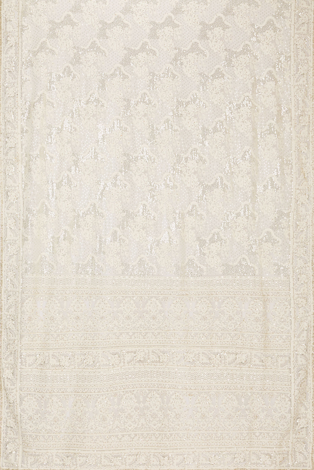 Flat view of Off White Dual Tone Georgette Saree with Embroidery on the body and Sequin Border. 