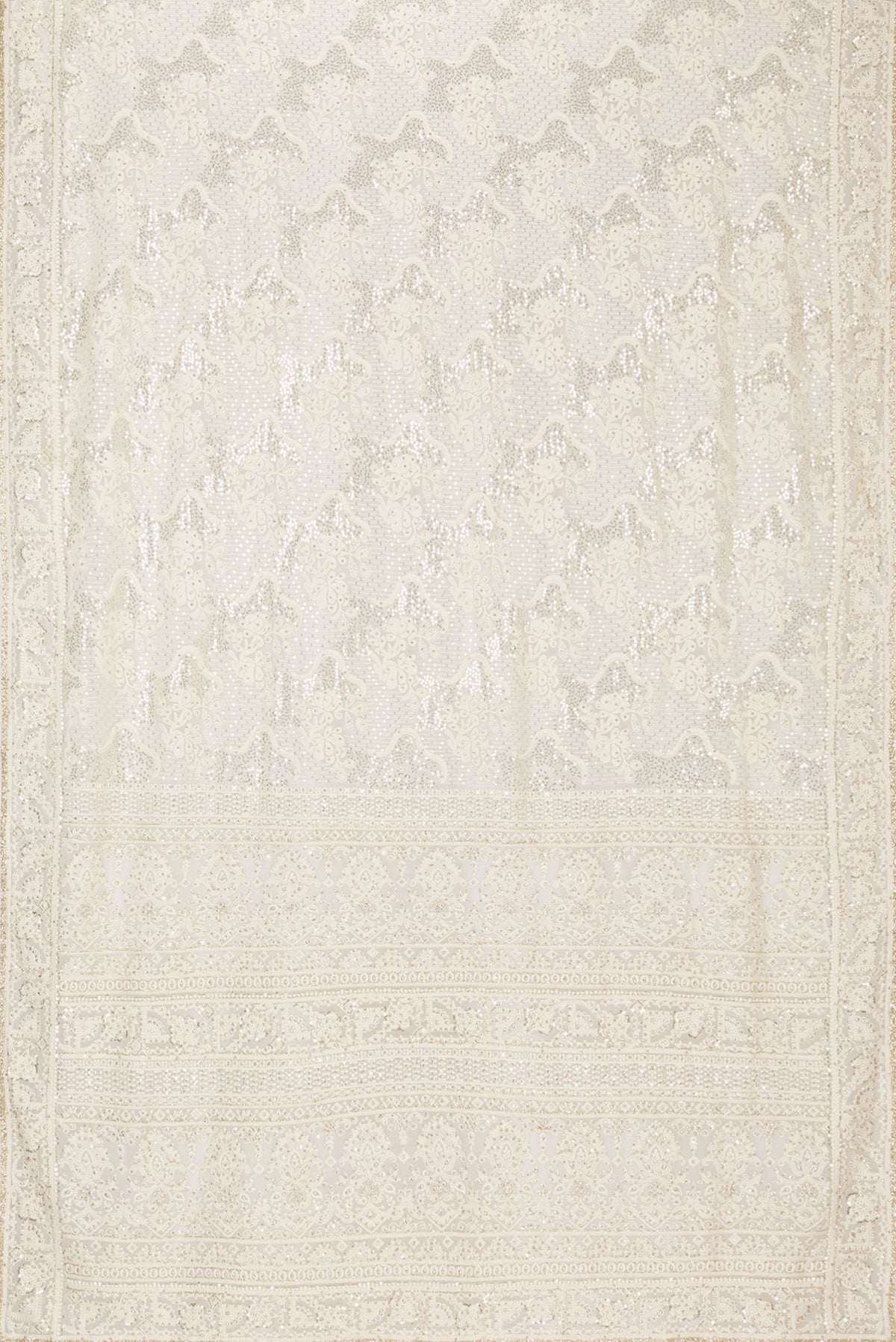 Flat view of Off White Dual Tone Georgette Saree with Embroidery on the body and Sequin Border. 