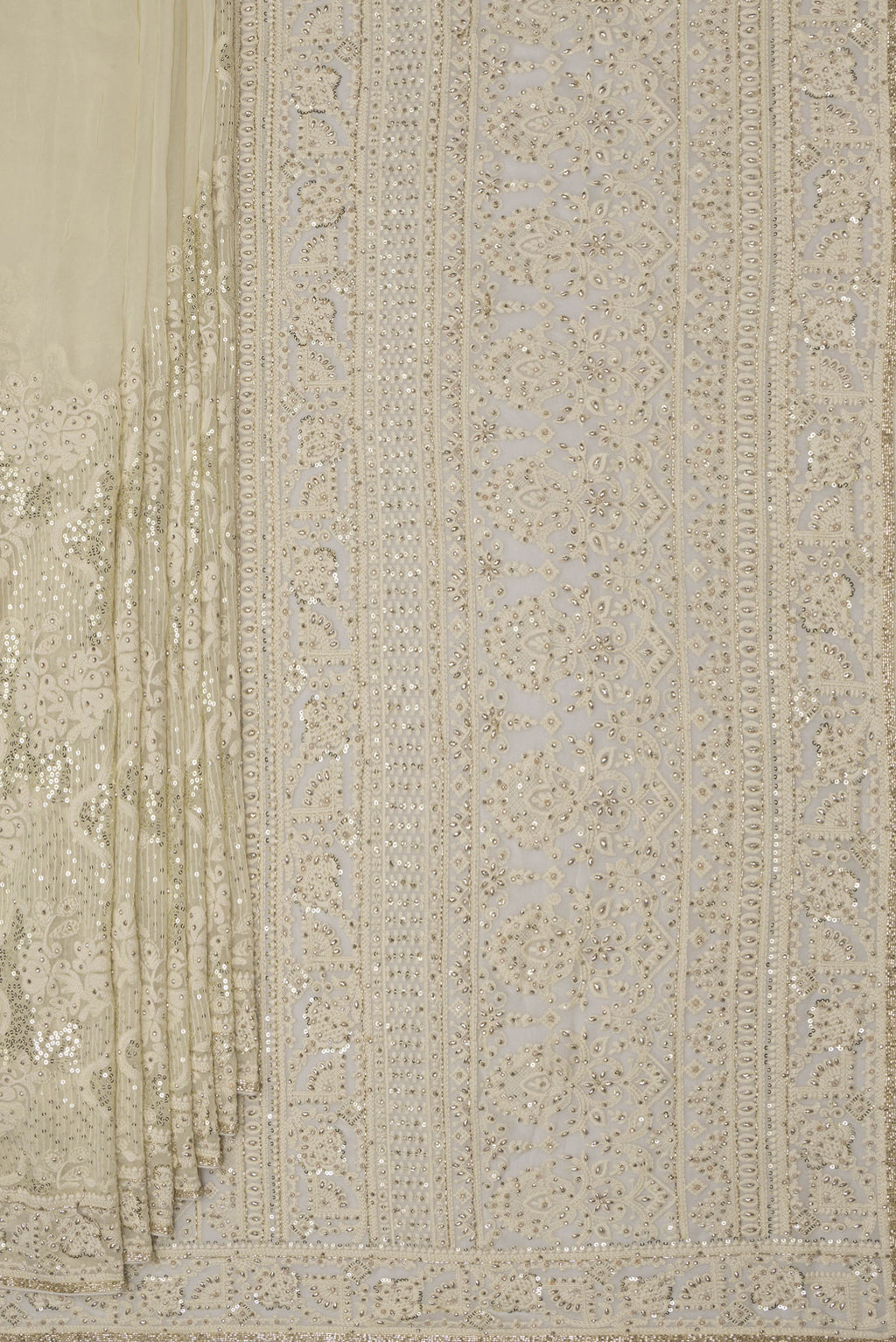 Pleats and pallu of Off White Dual Tone Georgette Saree with Embroidery on the body and Sequin Border. 