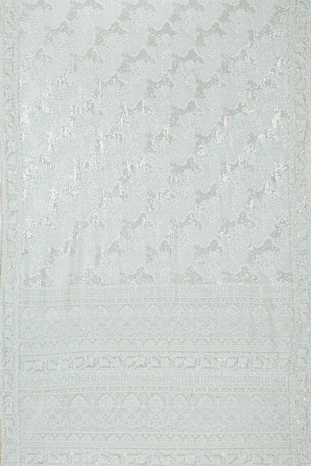 Flat view of Light Blue Dual Tone Georgette Saree with Embroidery on the body and Sequin Border. 