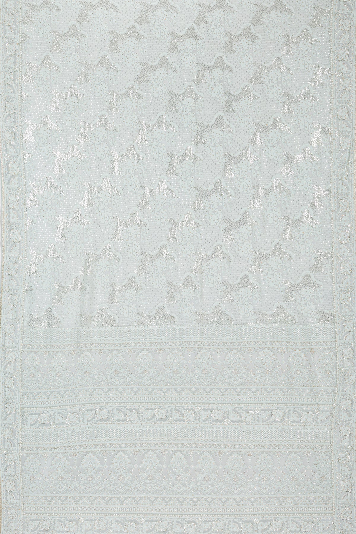 Flat view of Light Blue Dual Tone Georgette Saree with Embroidery on the body and Sequin Border. 