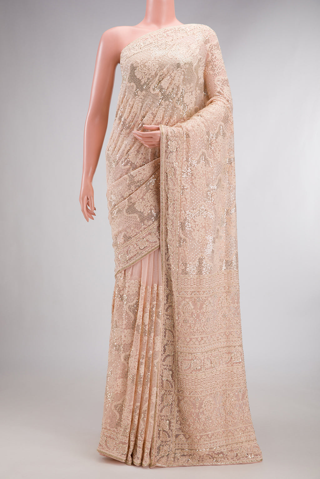 Peach Dual Tone Mysore Georgette Saree with Embroidered on the body and Sequin Border.  displayed on a mannequin