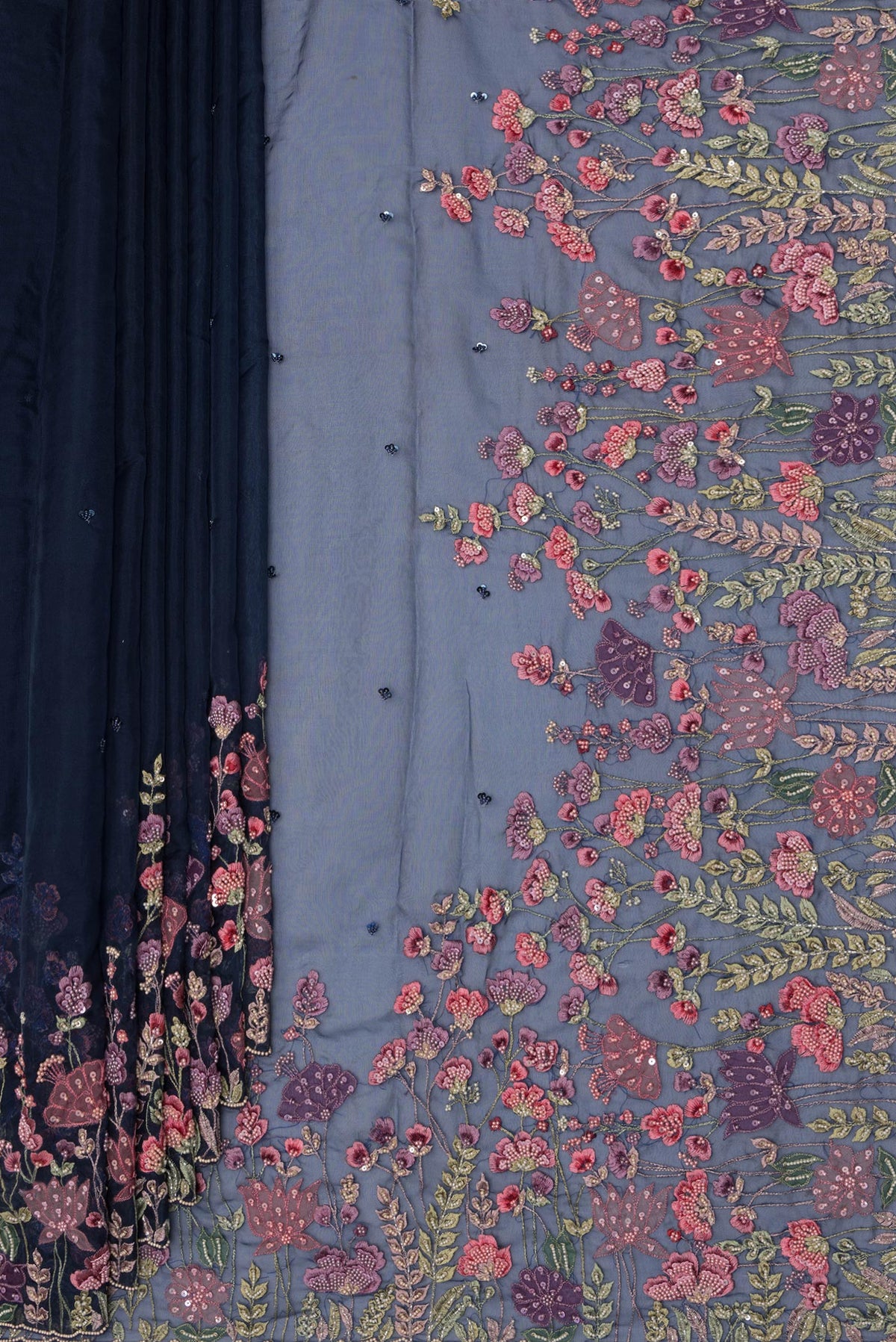 Pleats and pallu of Pure Silk Navy Blue Dual Tone Organza Saree with Embroidery on the body and Sequin Border. 