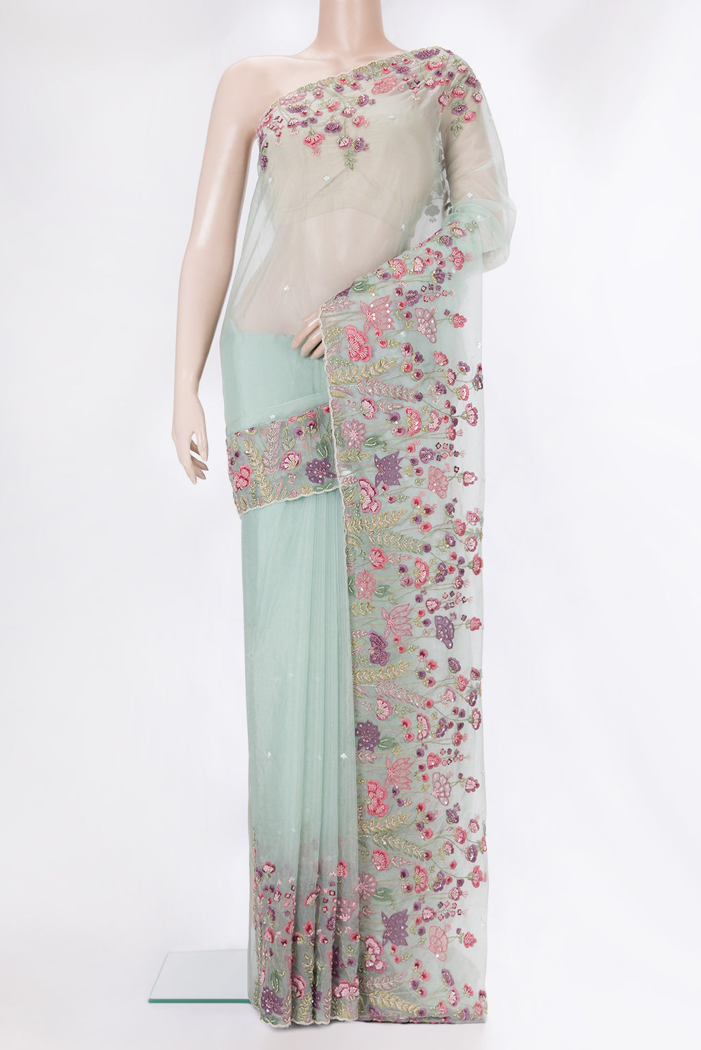 Pure Silk Light Green Dual Tone Organza Saree with Embroidery on the body and Sequin Border.  displayed on a mannequin